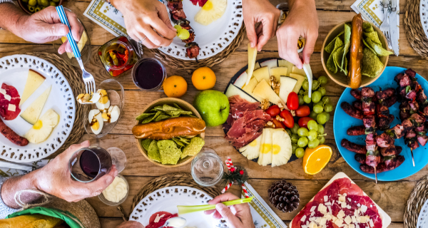 Table of people sharing a healthy meal.