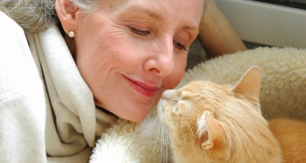 Senior helping at an animal shelter