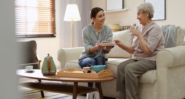Hired help caring for a senior parent while the adult child is away