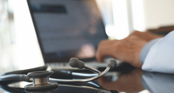 doctor recording health records on a health record website