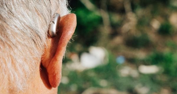 mature man with a hearing aid