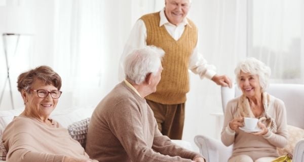 a group of mature men and women socializing together.