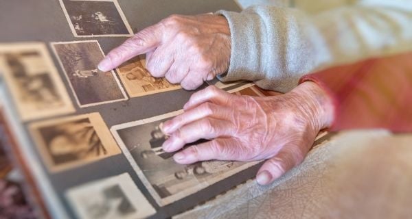 senior couple looking through a photo album together