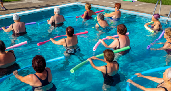 Group of people participating in pool aerobics.