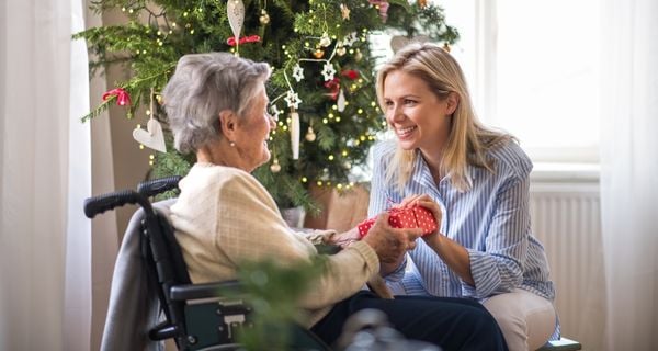 Woman visiting her family member with alzheimers for the holidays.