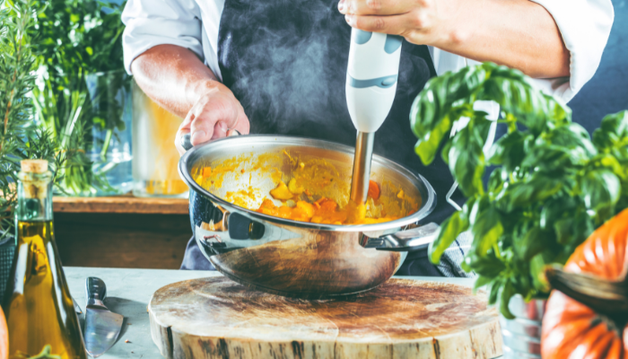 Chef uses immersion blender to puree food for special diet