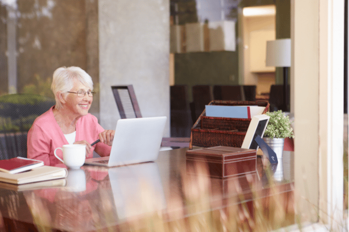 senior female FaceTiming with family