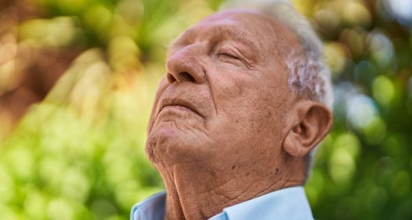 person practicing self care with deep breathing.