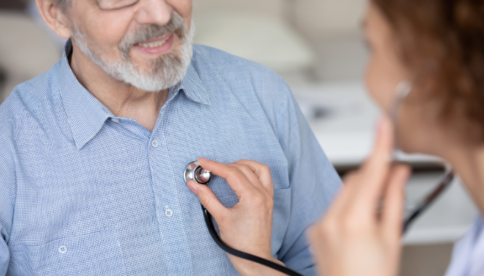 Senior man gets his heart checked at doctor