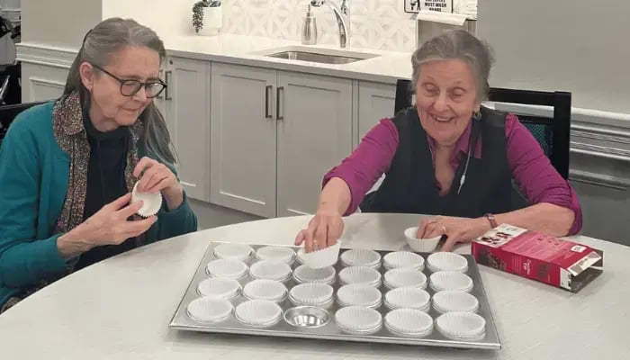 residents at The Bristal lining a cupcake tin