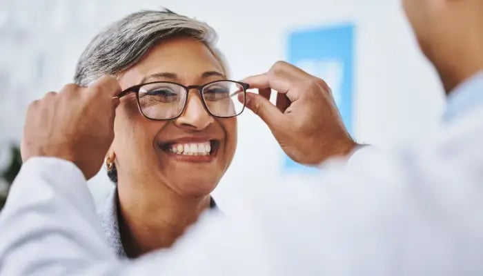 Mature woman getting new glasses