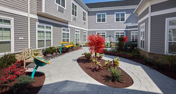 Outdoor courtyard in Reflections memory care area at The Bristal at Mount Sinai in Mount Sinai, NY.