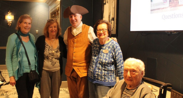 Residents at The Bristal at Jericho pose with the historian guest lecturer