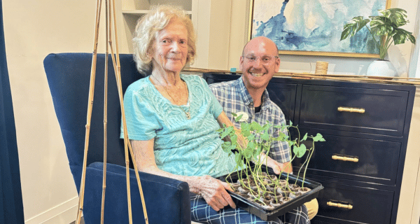 Residents of The Bristal at Waldwick display green bean plant