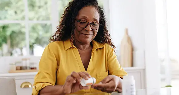 Senior woman taking her medication