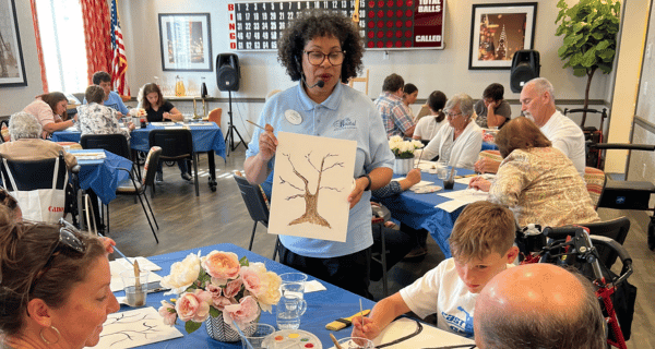 The featured activity for Grandparents Day at West Babylon was an intergenerational Paint and Sip activity.