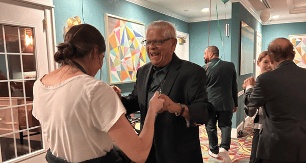 Resident at Mount Sinai and team member dancing during the holiday party in 2024.