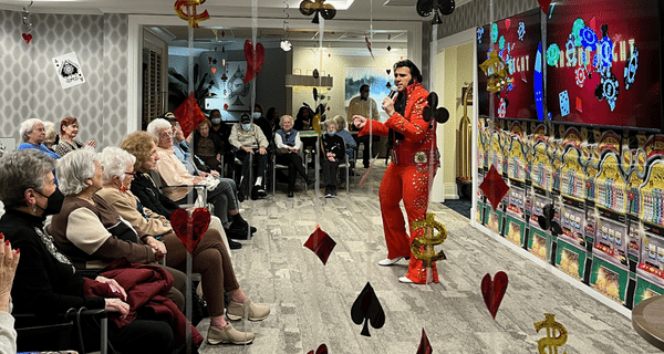 Elvis impersonator performing for group of seniors