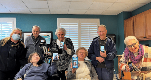 group of seniors posing with their phones