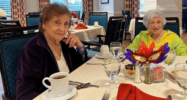 senior women enjoyed mardi gras themed lunch