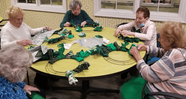 senior women working on St. Patrick's Day wreaths