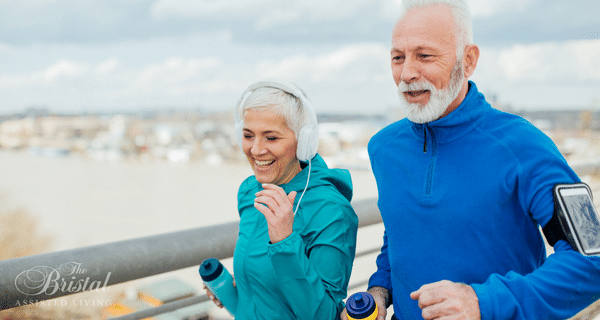 senior couple using smartphones to exercise
