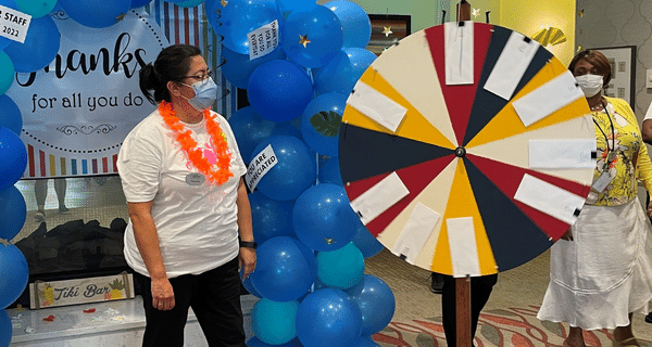 team member spinning prize wheel