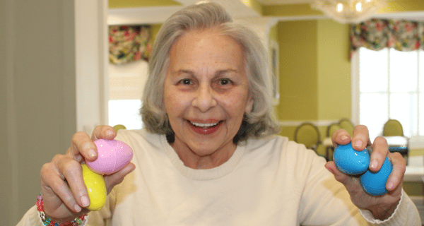 senior woman holding easter eggs