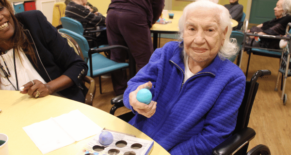 senior woman holding Easter egg