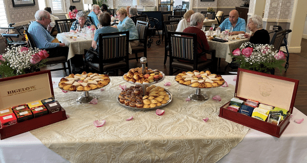 group of seniors enjoying a tea party