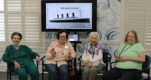 senior women seated underneath Titanic presentation