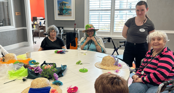 seniors and team members making derby hats