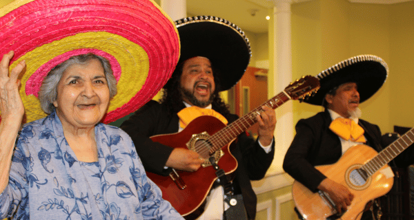 senior woman with mariachi band