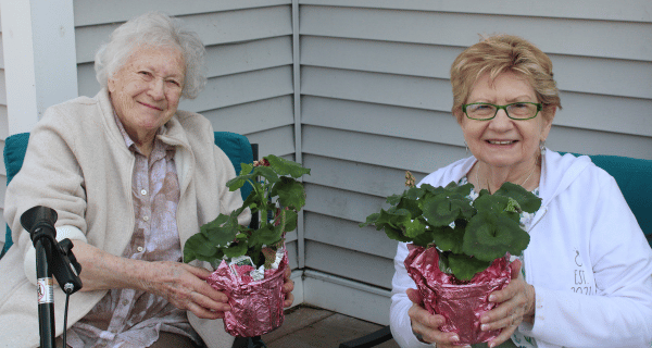 senior women holding plants