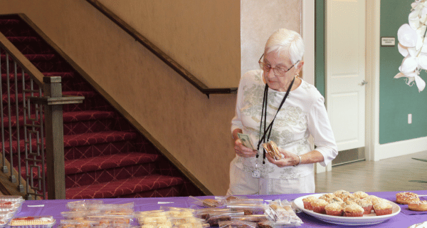 senior woman at bake sale