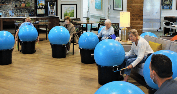 group of seniors participating in cardio drumming class
