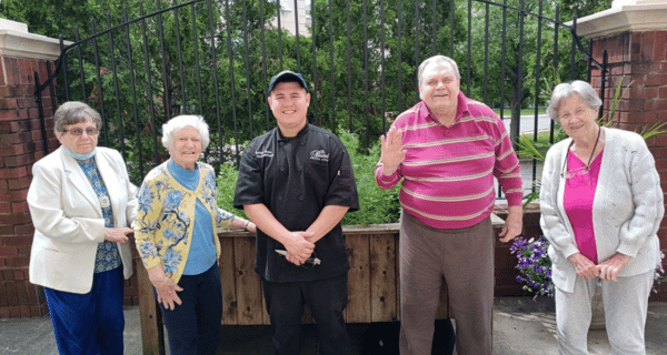 members of the garden club posing for photo