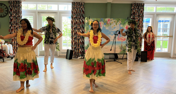 polynesian dancers performing for group of seniors