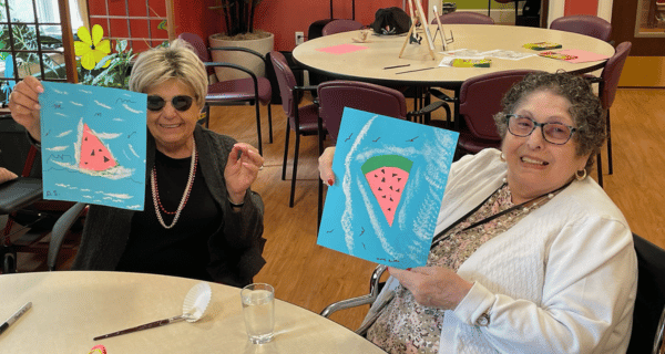 senior women holding watermelon craft project