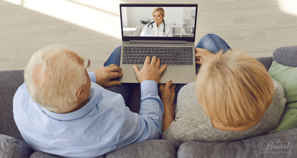 senior couple participating in telehealth appointment