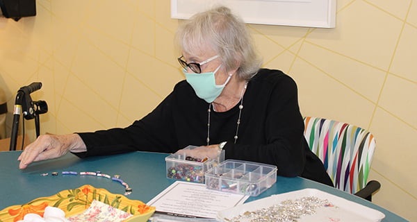 Making Mask Necklaces in Englewood