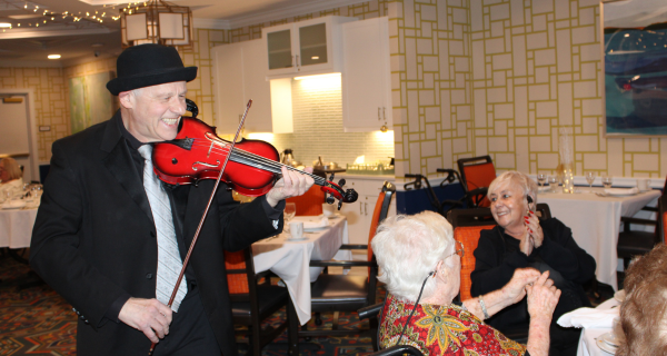 Violin playing for residents during the gala
