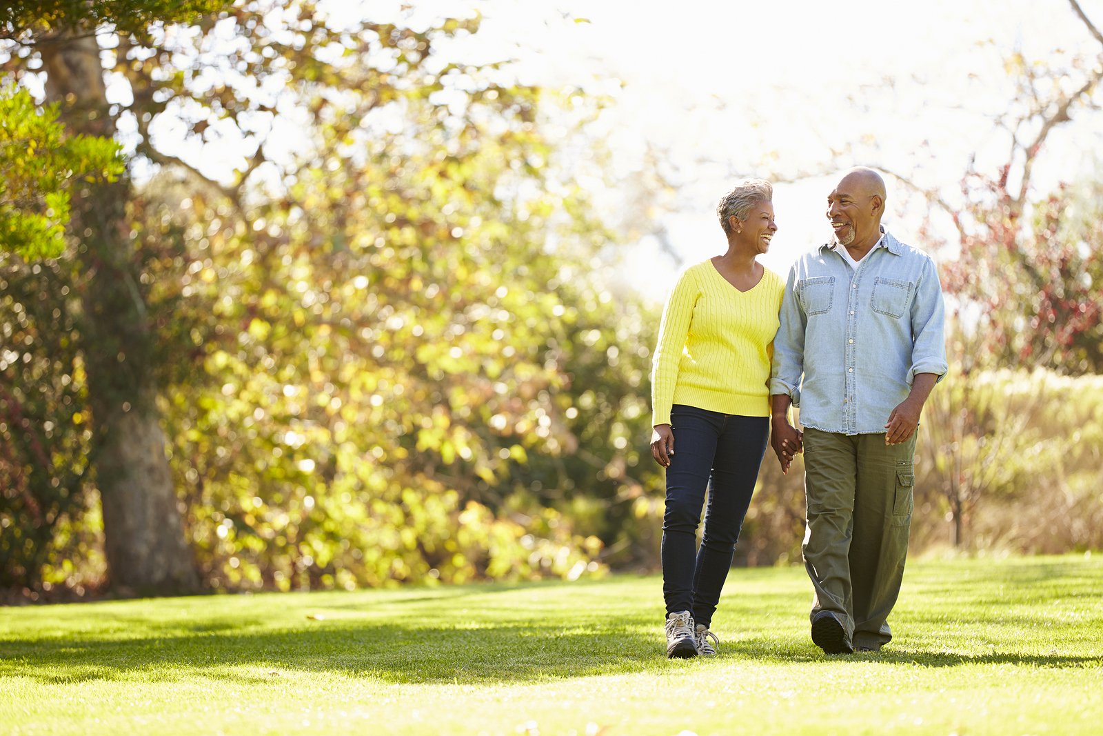 Senior couple participating in seasonal walk in independent living community
