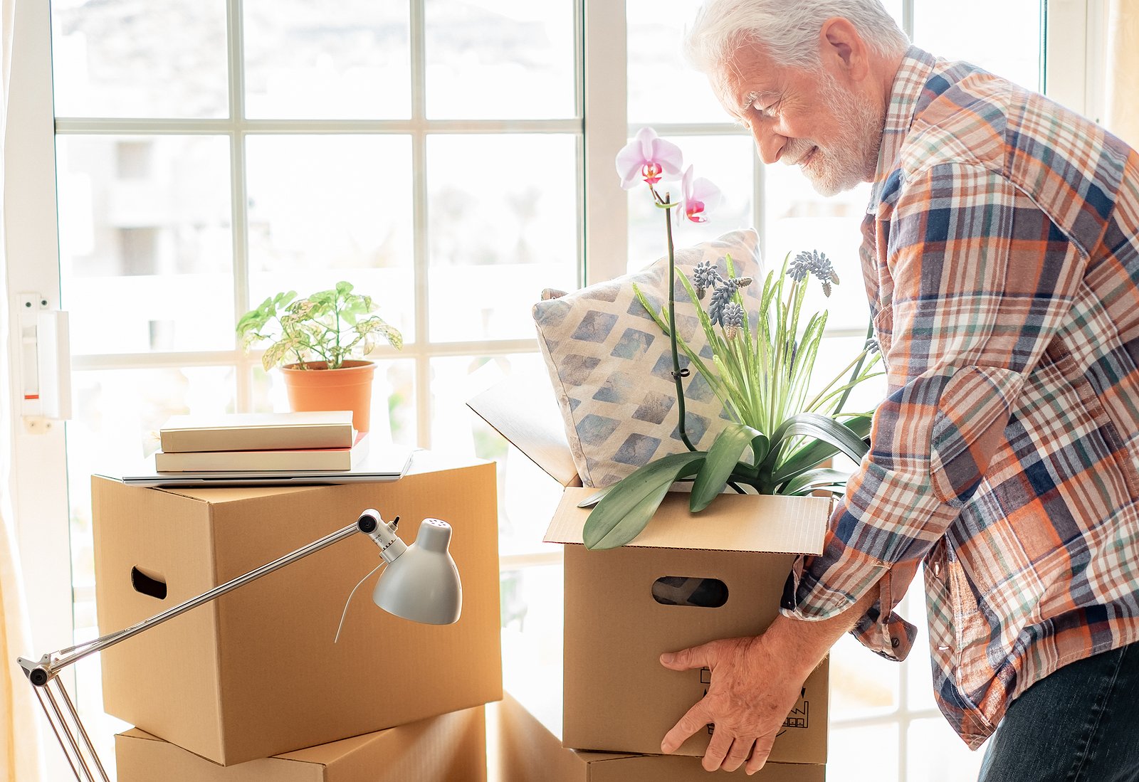 Happy senior man moving to senior living