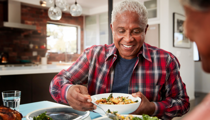 Senior man having an elevated dining experience at home