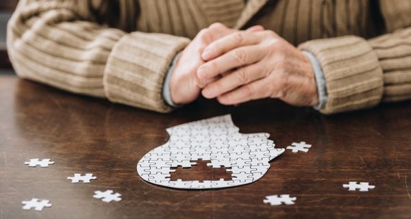 Person with Alzheimer's putting a puzzle together.