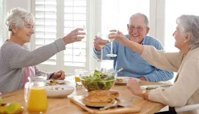 A group of seniors sharing a meal from the mind diet