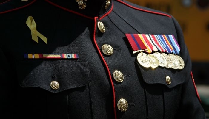 Veteran in dress uniform with medals.